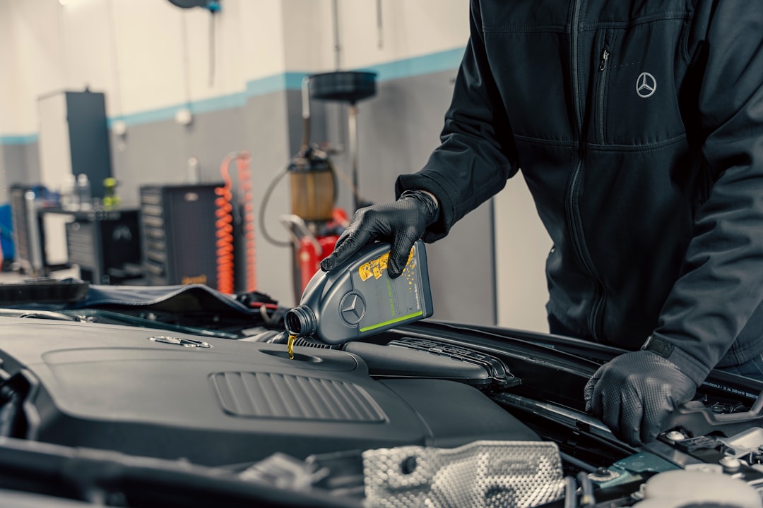 creative-approach-img mechanic-pouring-oil-into-car-engine-gw34cv-ojjs